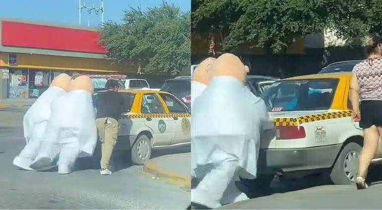 Momento en el que botargas apoyan a taxista