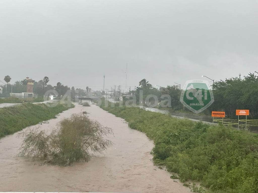Dren Bacurimi con agua por tormenta Norma