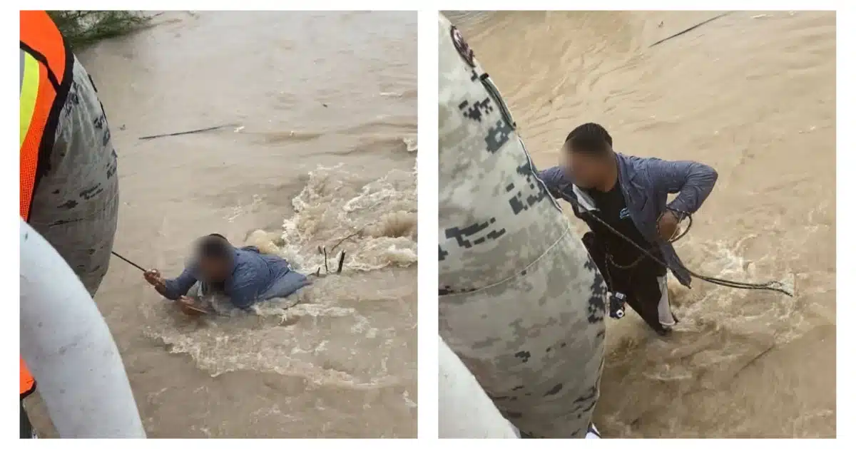 Hombre siendo rescatado por Guardia Nacional