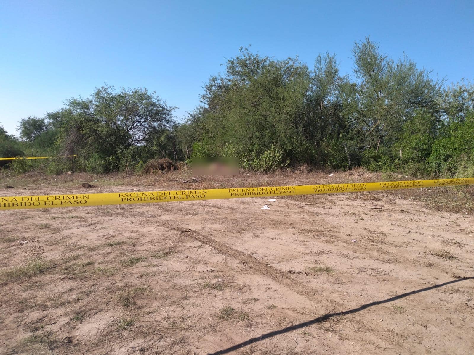 Zona rodeada de cinta amarilla