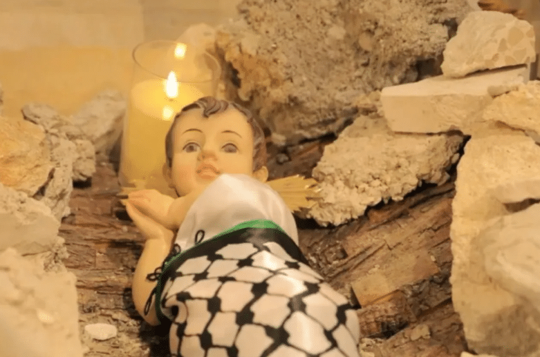 Niño Jesús sobre los escombros