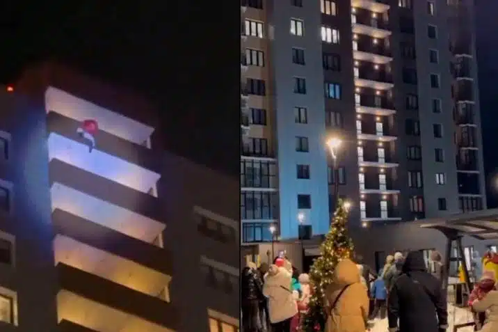 El hombre, vestido como Santa Claus, cae desde un edificio
