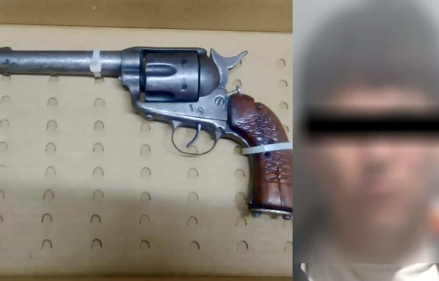 Arma y hombre detenido
