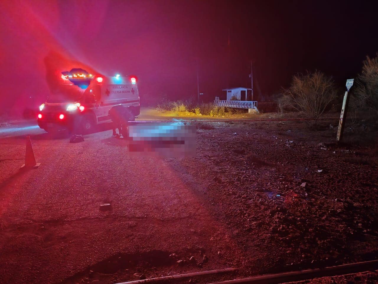 Persona tirada en carretera
