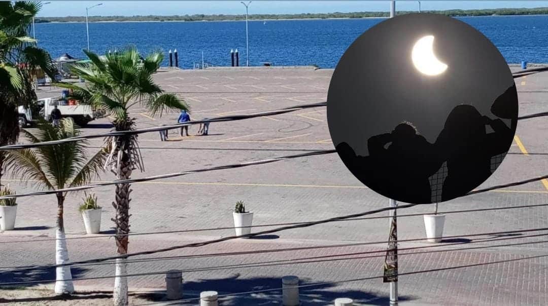 Altata, Navolato (fondo), personas observando eclipse solar (circulo)