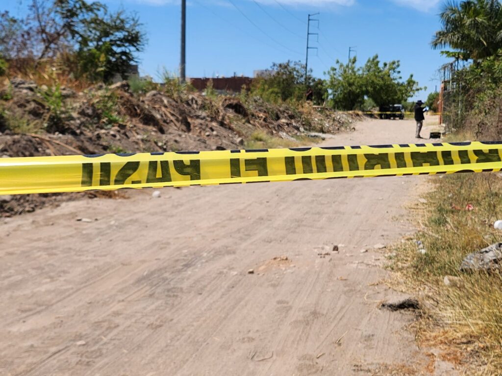 Cinta amarilla delimitando zona donde se encontró cuerpo sin vida en Culiacán
