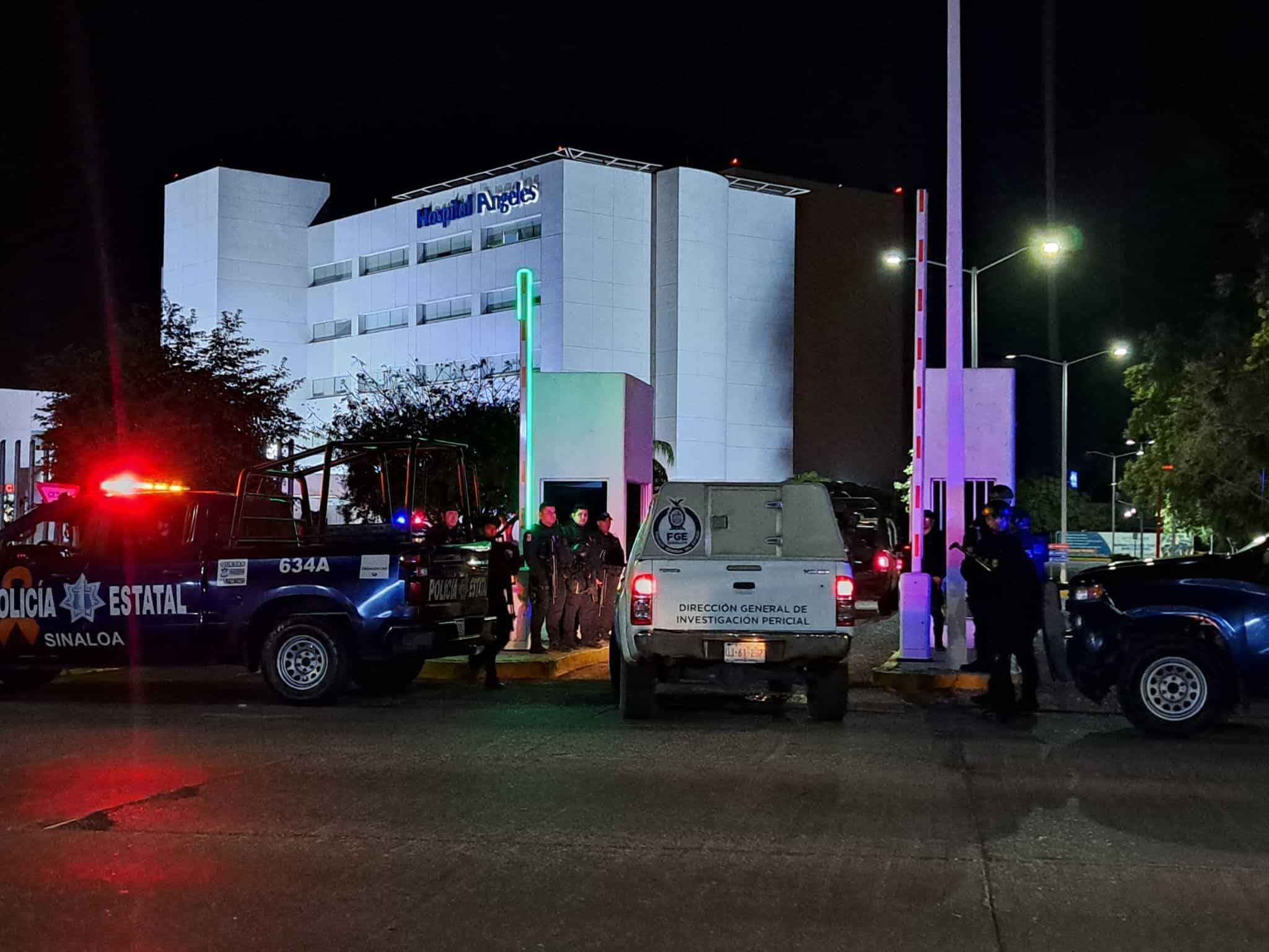 Elementos de la Policía Estatal resguardando el Hospital Ángeles de Culiacán y una camioneta de la FGE ingresando