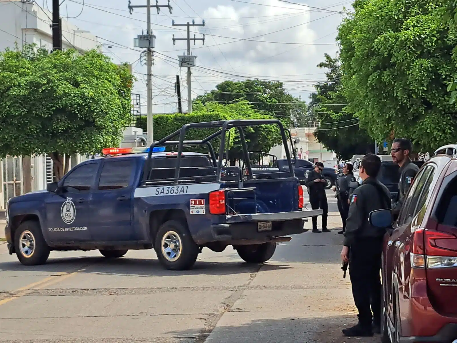 Patrulla de la policía Municipal de Culiacán y dos elementos