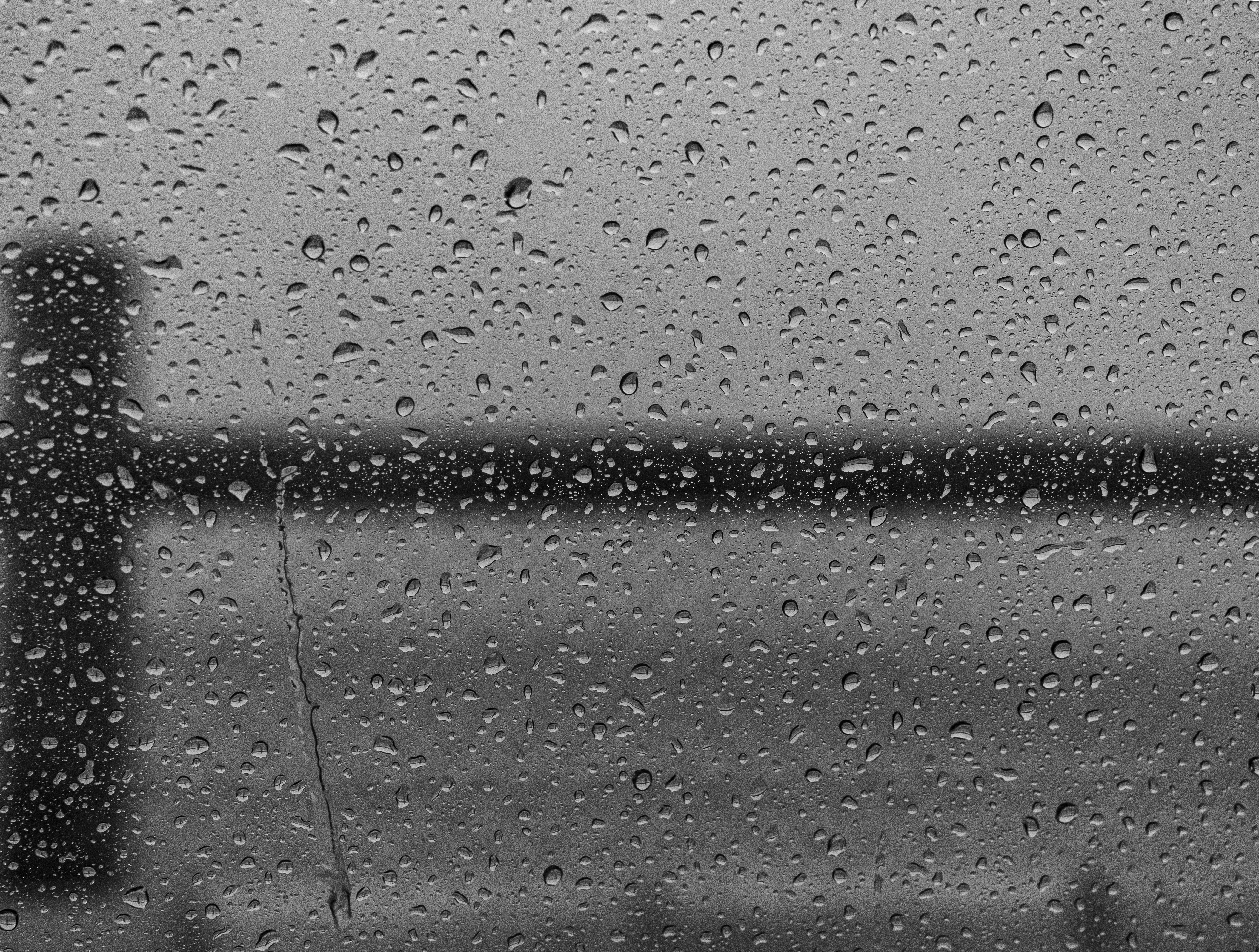 Closeup shot of water drops on a window glass after the rain