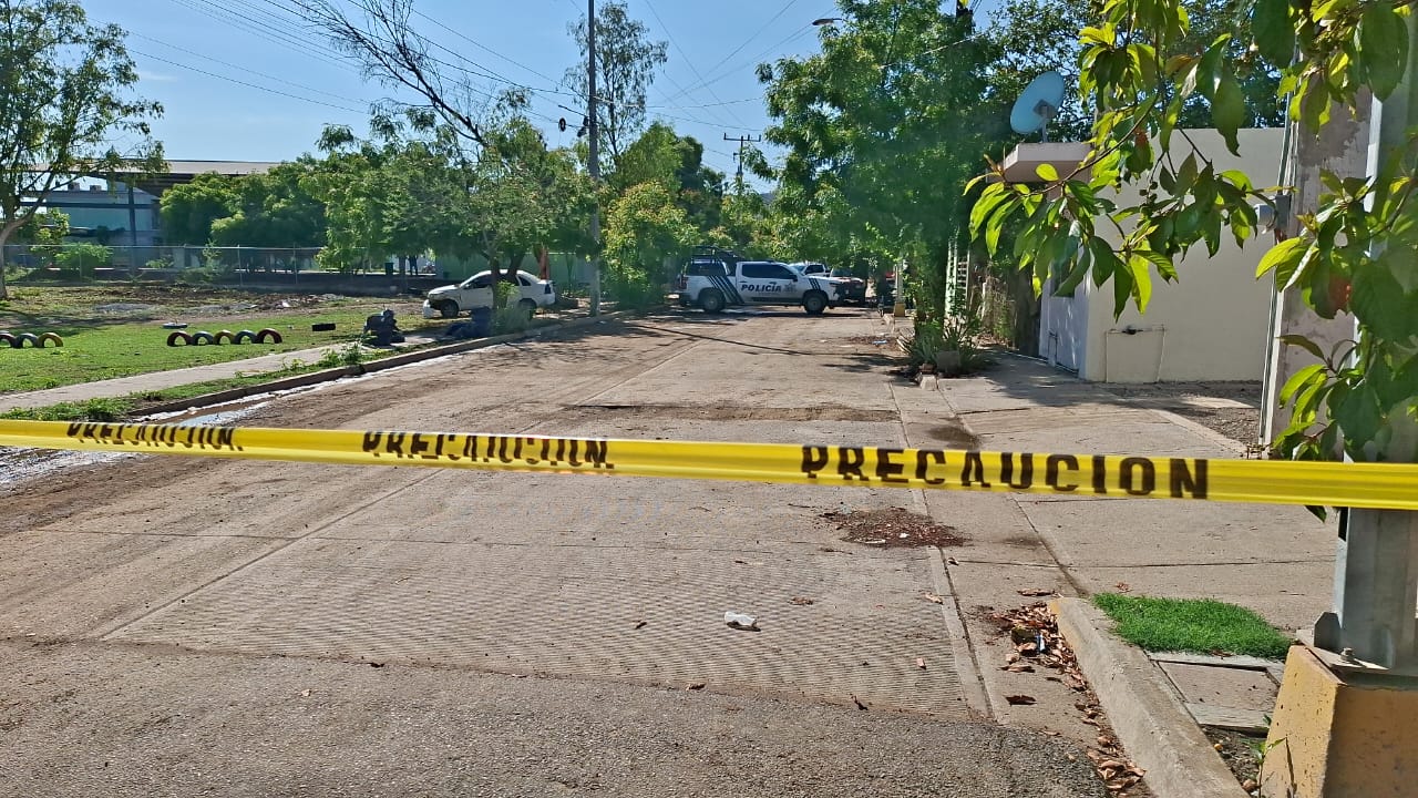 Zona acordonada en la calle donde ocurrió el asesinato.