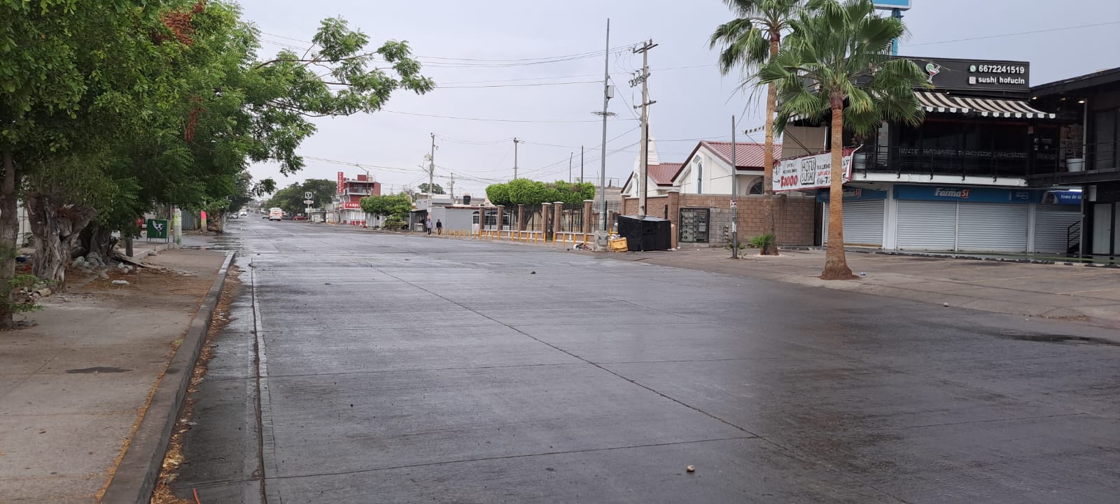 Pavimento mojado tras lluvias en Culiacán