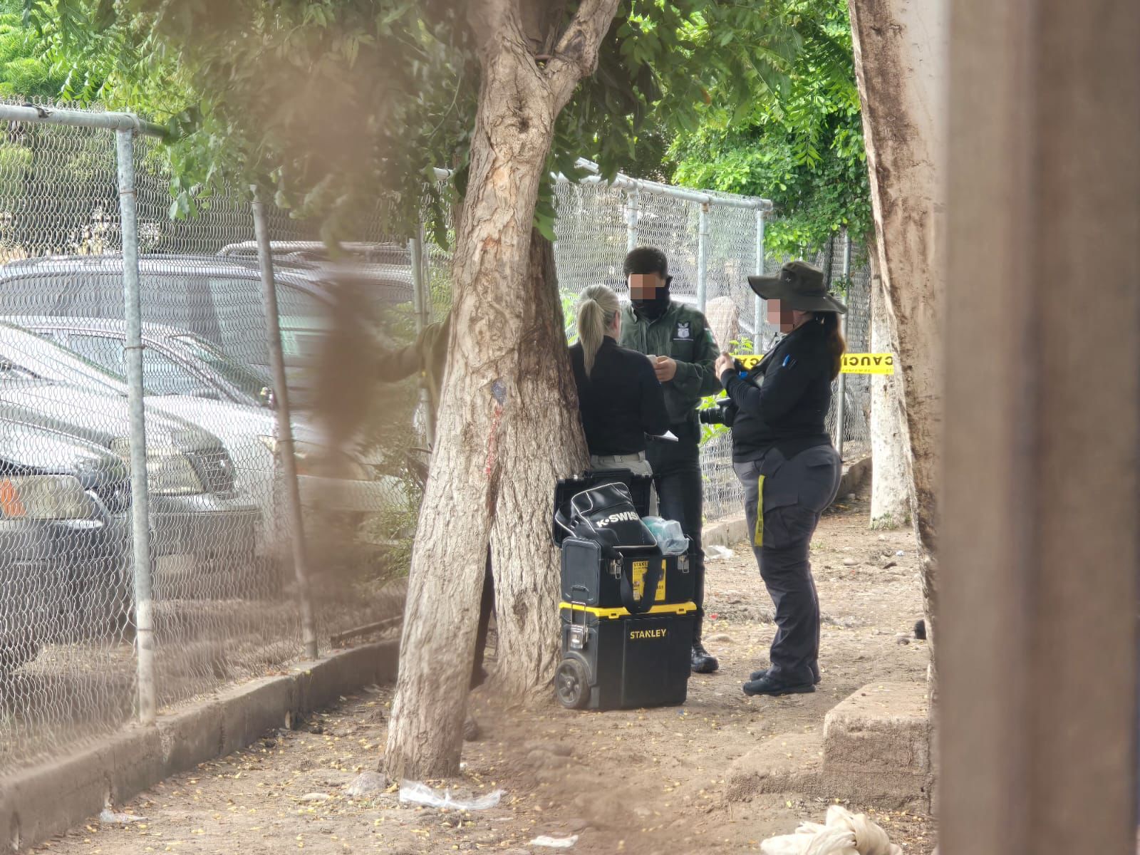 Autoridades presente en el lugar del asesinato.