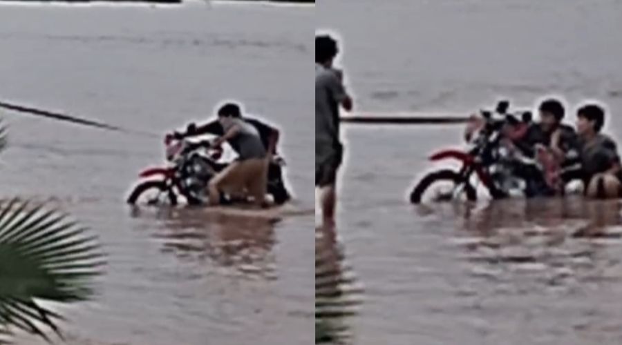 Jóvenes desafían “furia” del agua en la calle 300 en Guasave