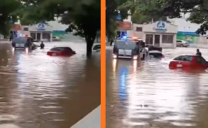 Agente de tránsito auxilia a ciudadanos y saca vehículos varados durante las lluvias del viernes 26 de septiembre en Culiacán