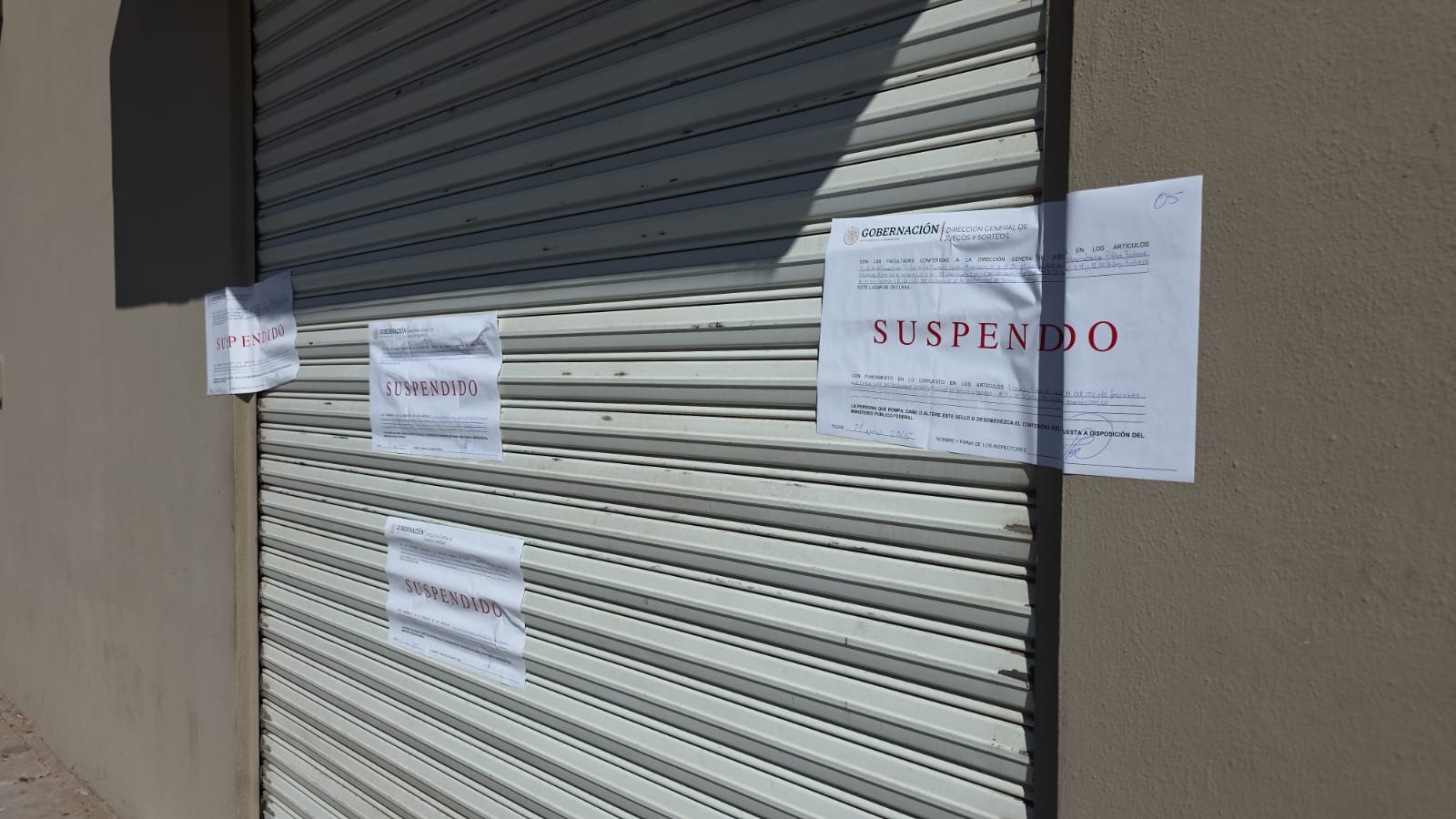 Aviso de suspendido en establecimiento