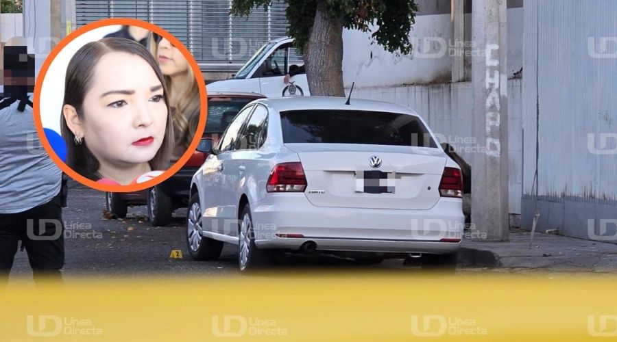 Carro balnco con cinta amarilla de precaución junto a la Fiscal de Sinaloa