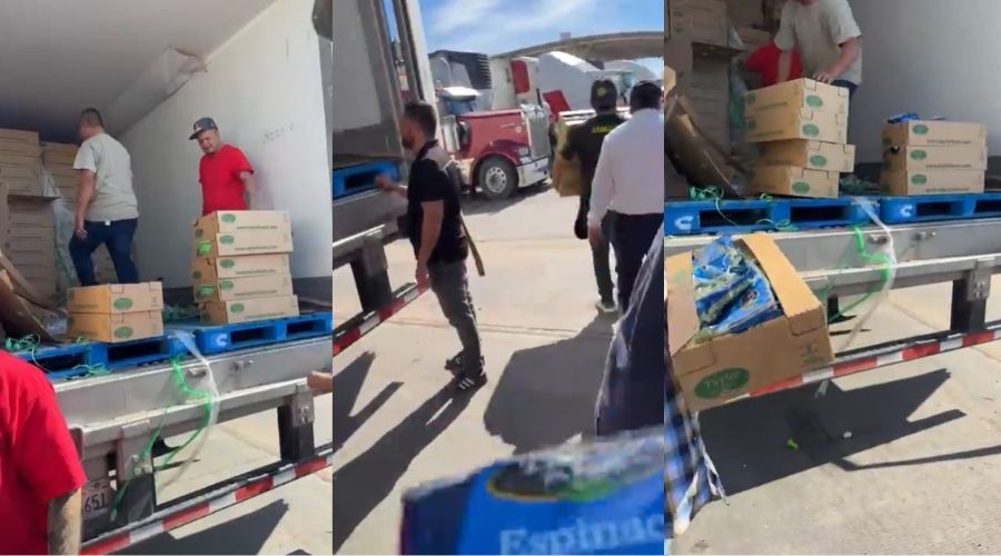 Personas descargando cajas de un tráiler