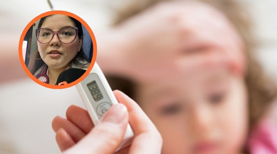 Niña con temperatura y un termómetro
