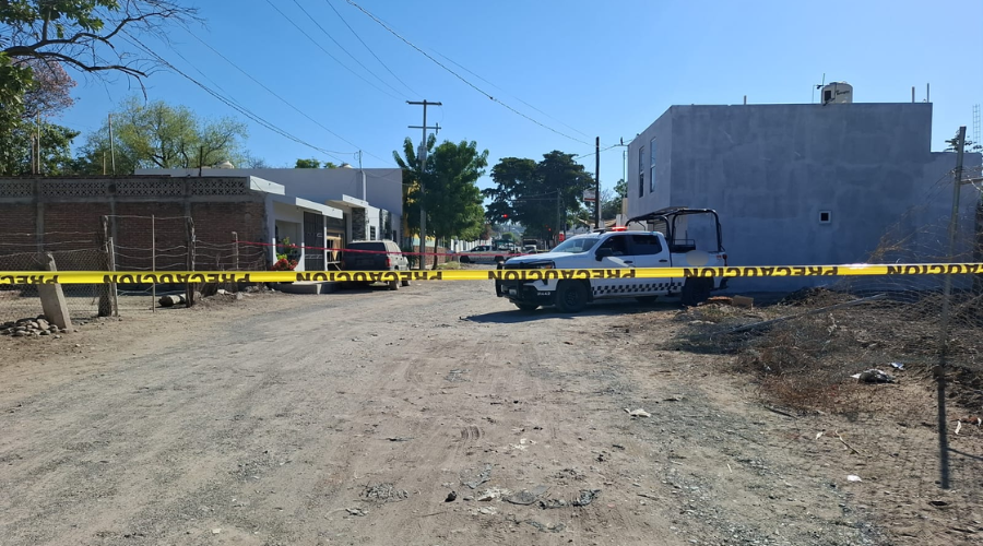 Zona acordonada y unidades de seguridad detrás