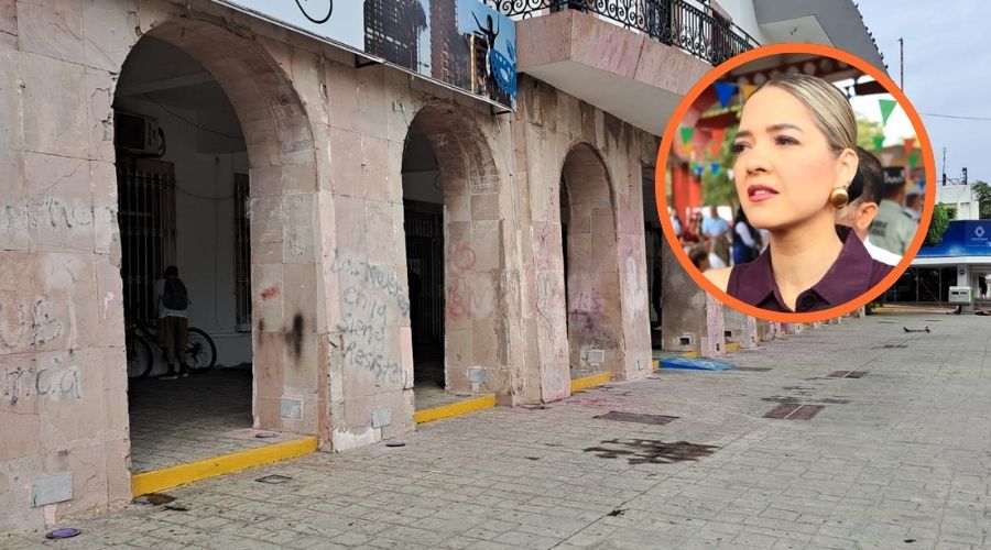 Edificio rayado junto a la alcaldesa Estrella Palacios