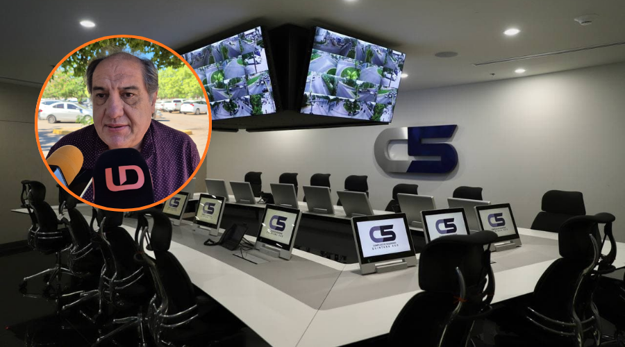 En grande oficinas de seguridad C5 con pantallas de vigilancia y en circulo Javier Llausas Magaña
