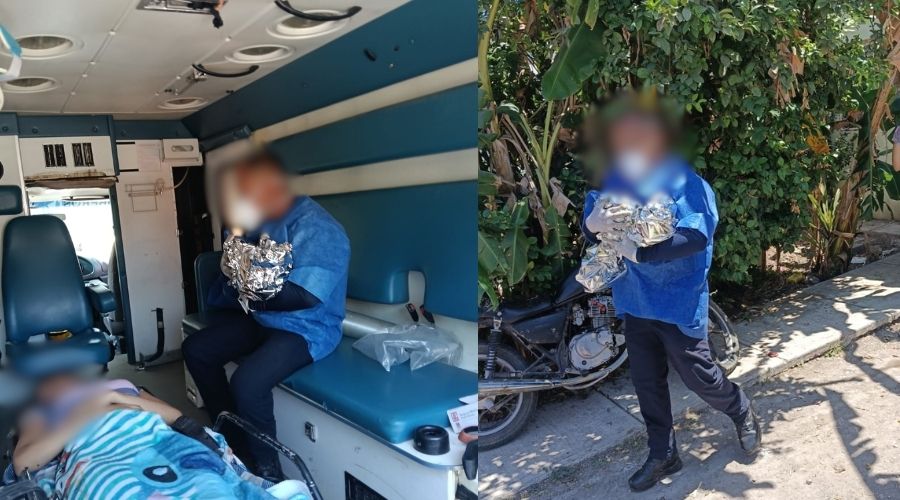 Médico con una manta térmica con un bebé y una persona acostada en la camilla