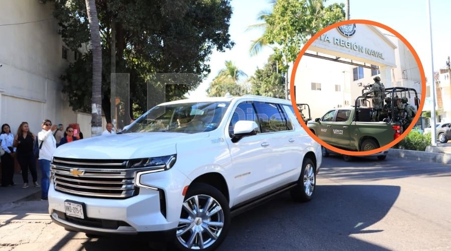 Camioneta suburban blanca junto a un circulo con la entrada de la Cuarta Región Naval