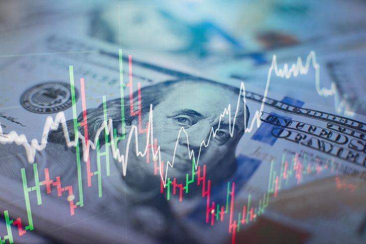 Billete de dólar con un holograma de barra indicando altas y bajas