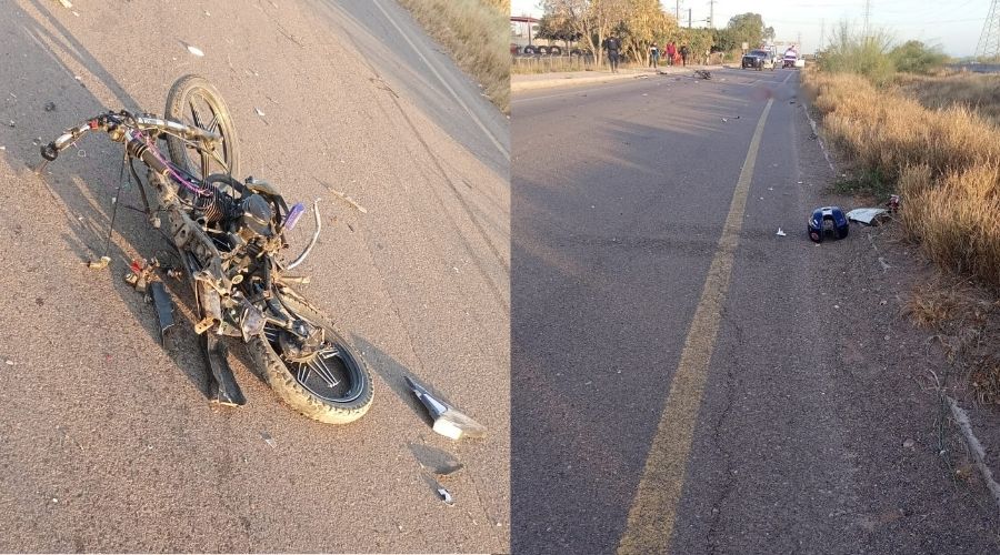 Escena de un accidente en una calle, una motocicleta tirada y un casco, al fondo unidades de emergencia