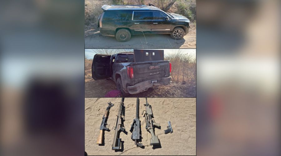 Dos camionetas de color negro y cuatro armas de diferente calibre