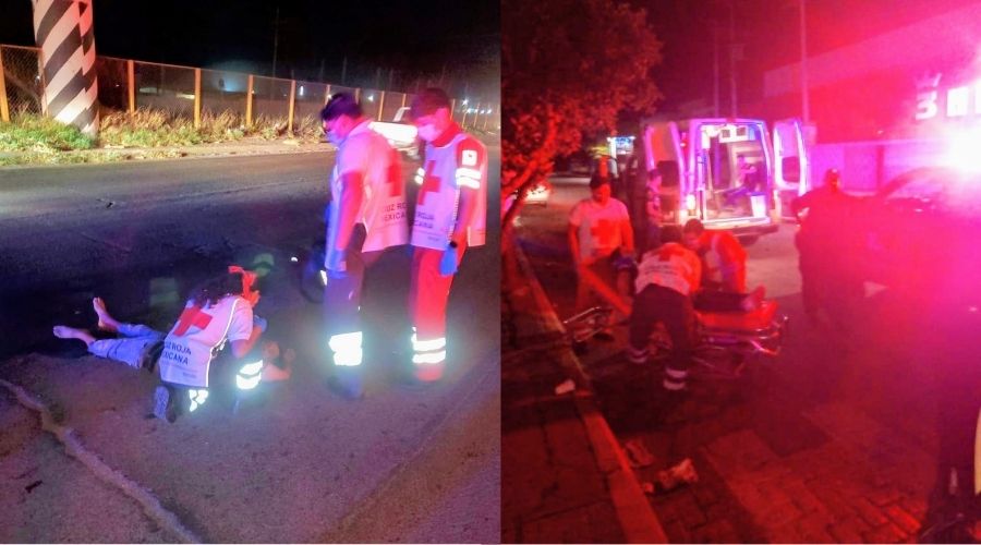 Personal de Cruz Roja apoyando a personas tiradas en el suelo de una calle y unas luces de una unidad
