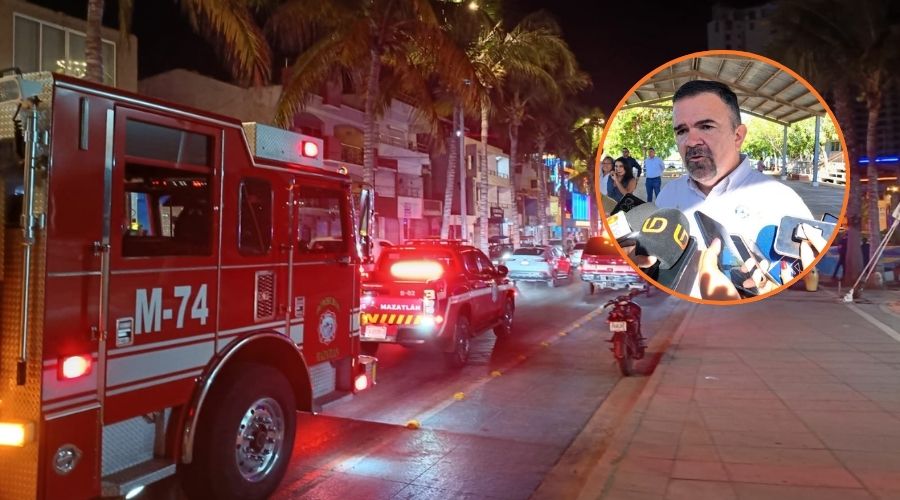 Óscar Roberto Osuna Tirado y al fondo unidades de Bomberos por un incendio