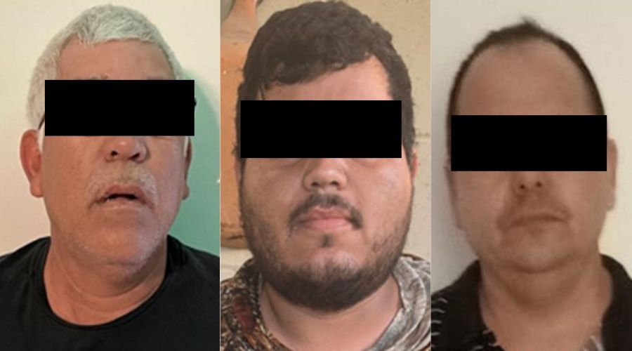 Tres hombres con los ojos tapados con cintillo negro