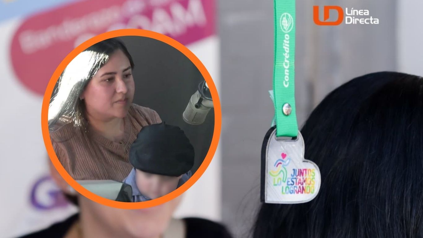 colgante con frase juntos lo estamos logrando y mujer con niño en brazos