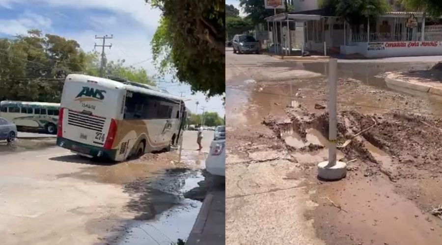 Lodo con agua en la calle junto a un autobús de pasajeros en Ahome