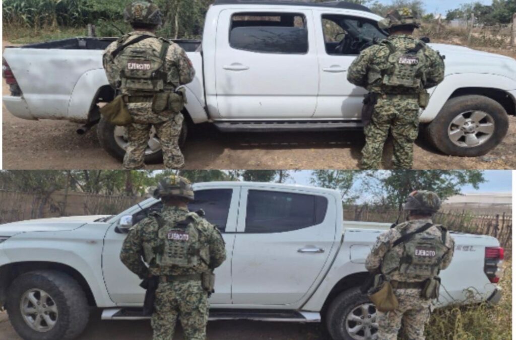 Elementos militares y al fondo dos camionetas que fueron aseguradas