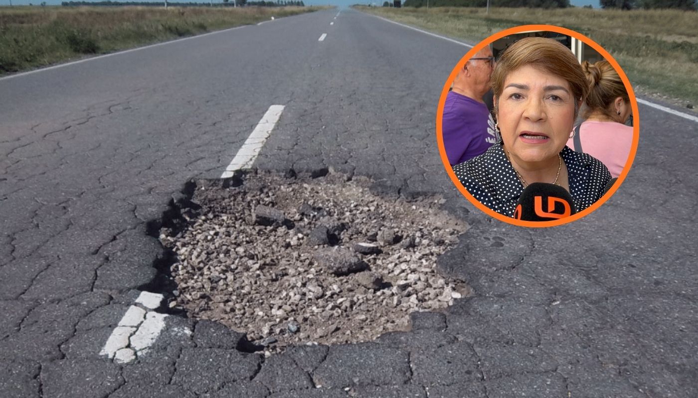 Bache en la carretera con tierra y piedras junto a alcaldesa de Guasave en un circulo