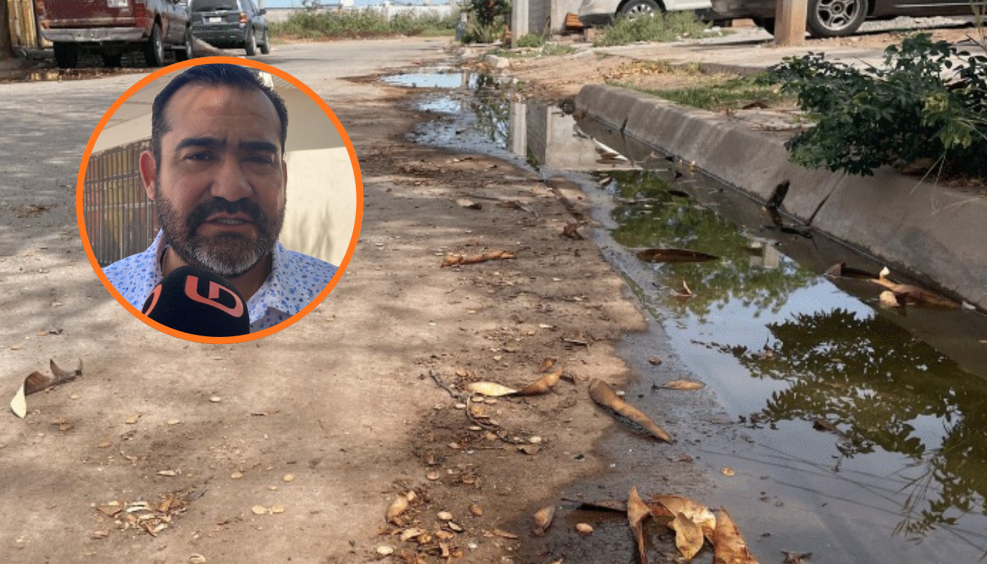 Agua estancada en calle de Ahome junto a el gerente general de Japama