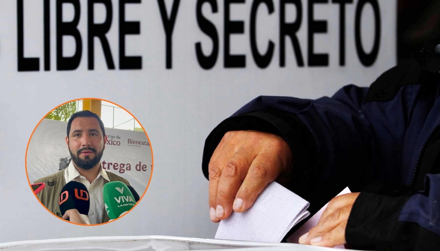 En grande mano de una persona depositando hoja de votación en urna