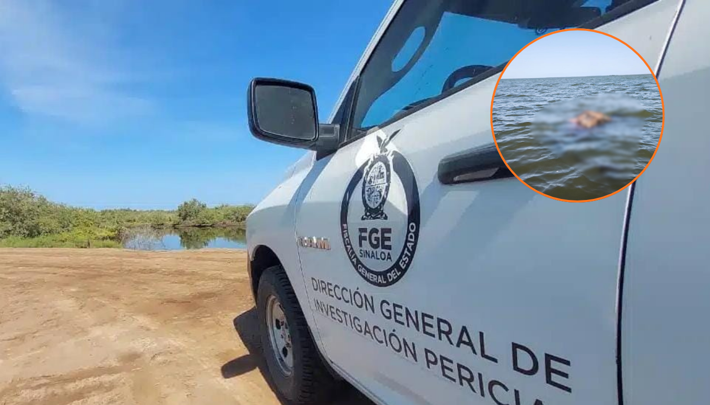 una camioneta de la fiscalia en la arena y agua al fondo