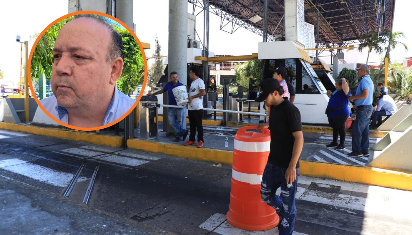 Miguel Ángel López Miranda junto a una caseta tomada con personas y cono naranja